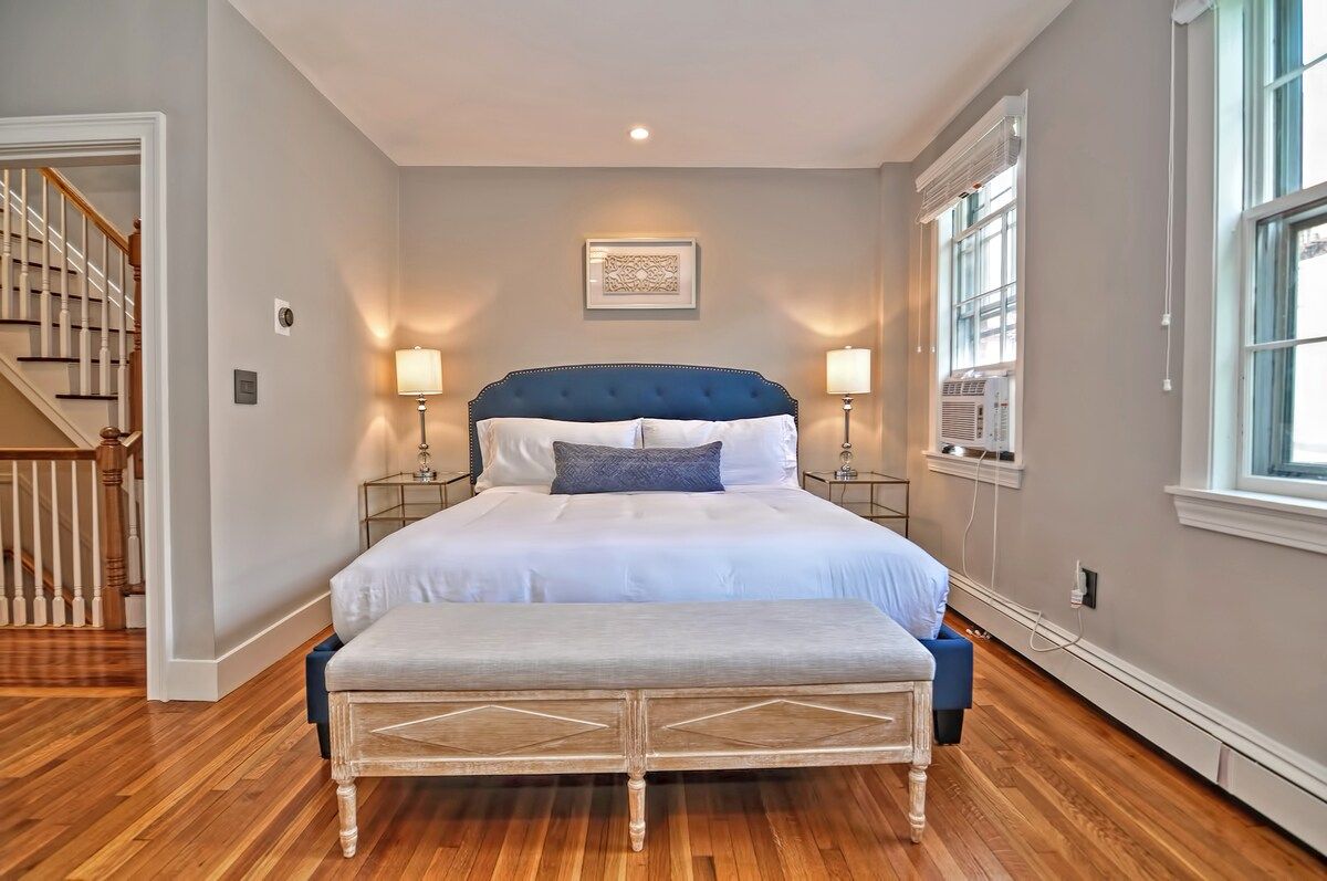 Spacious master bedroom with king bed and mountain views