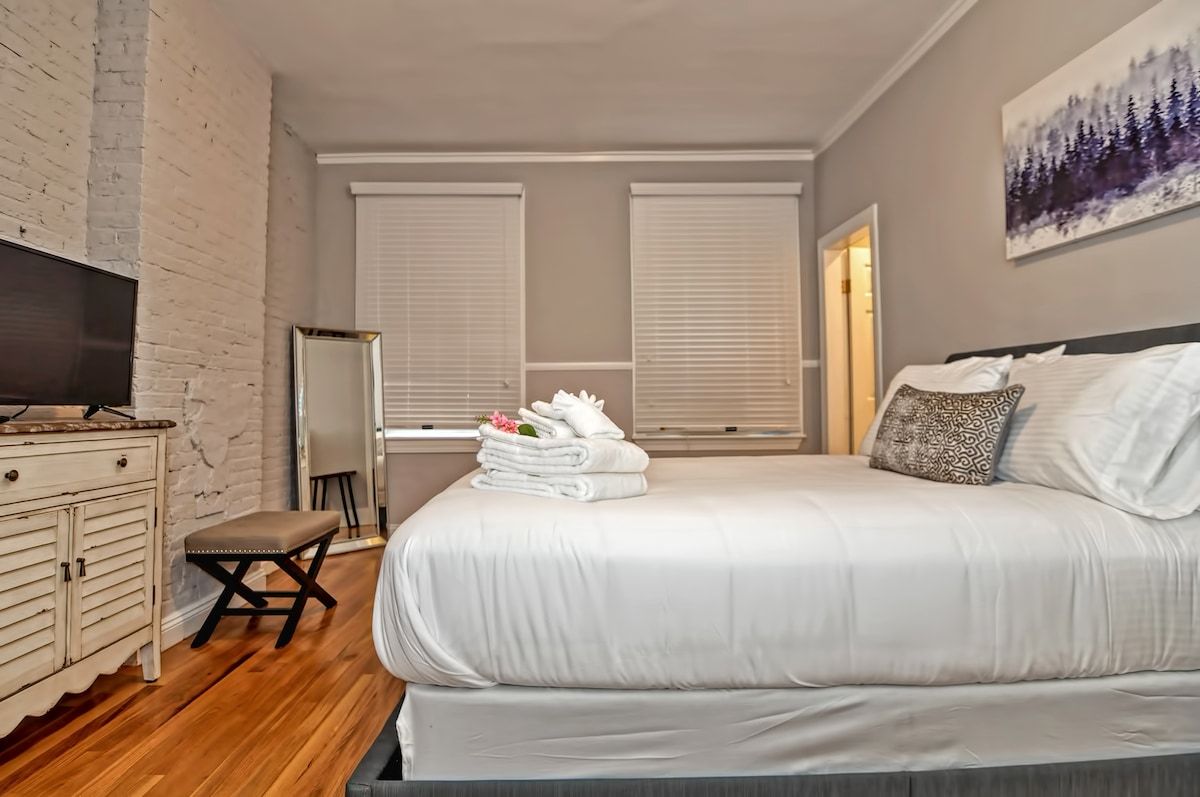 Spacious master bedroom with king bed and mountain views