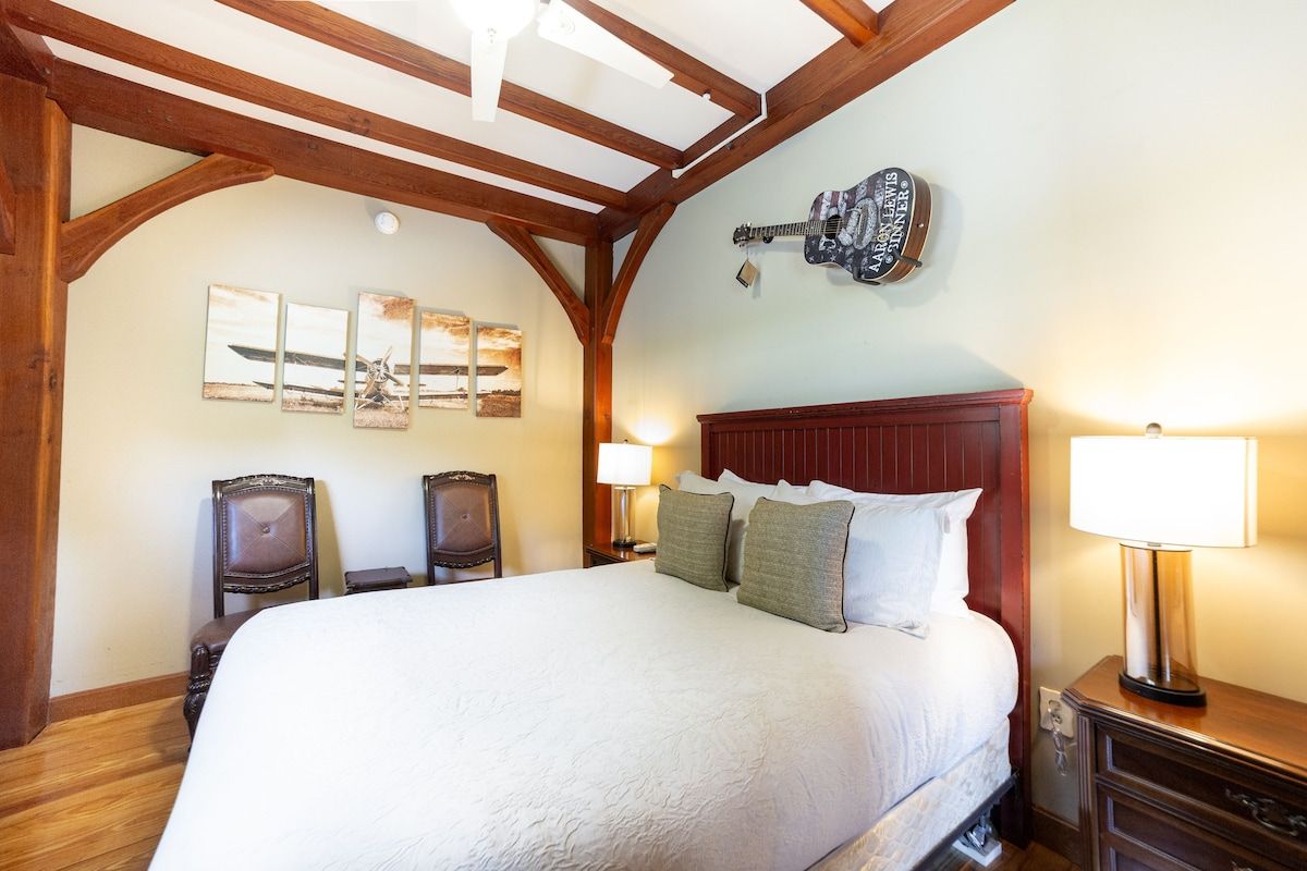 Spacious master bedroom with king bed and mountain views
