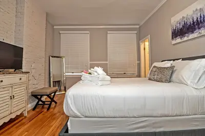Spacious master bedroom with king bed and mountain views
