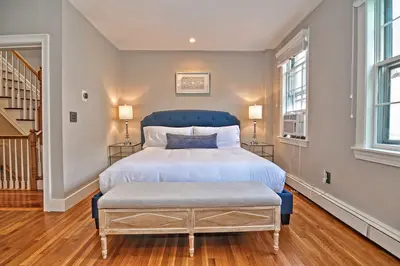 Spacious master bedroom with king bed and mountain views