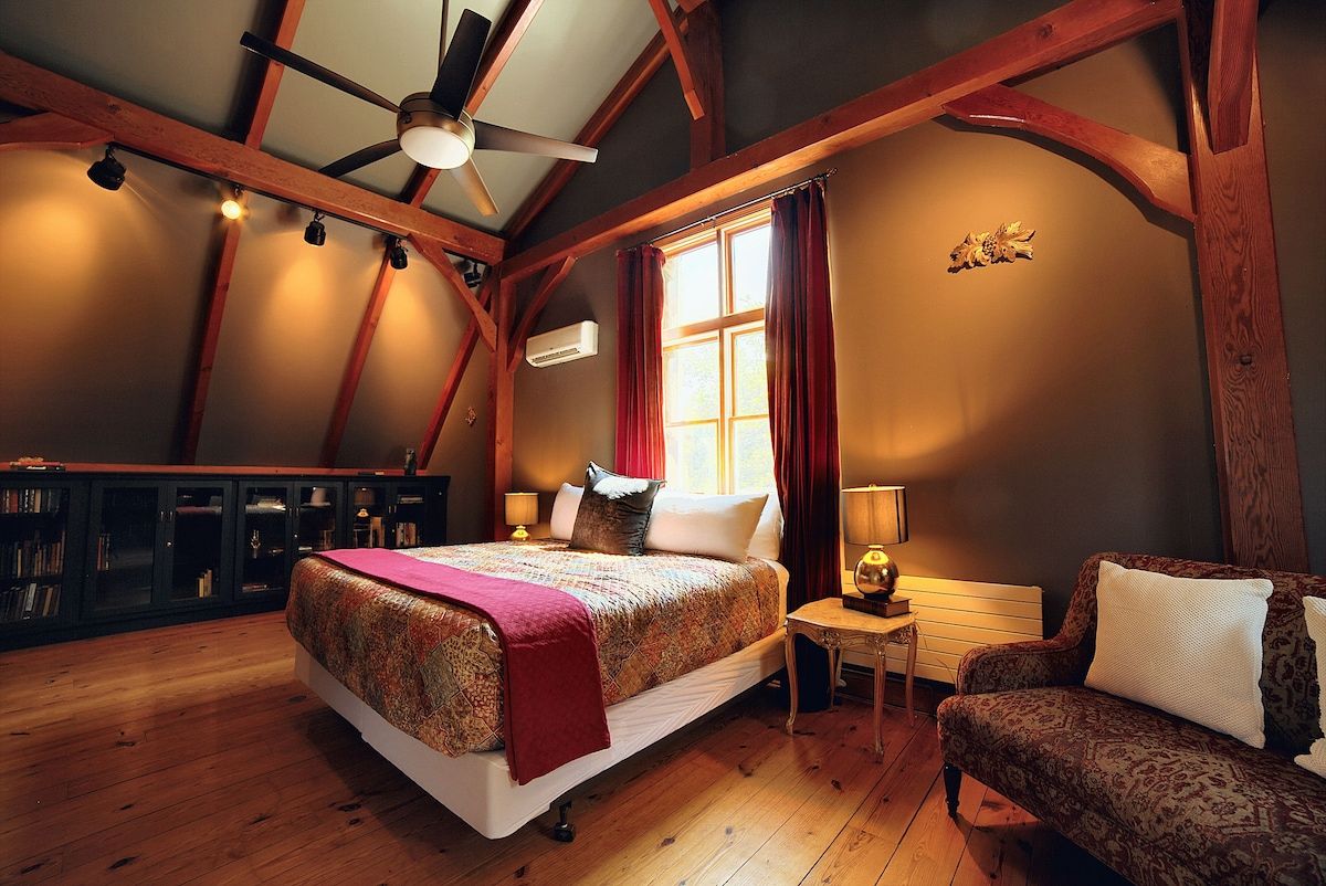 Spacious master bedroom with king bed and mountain views