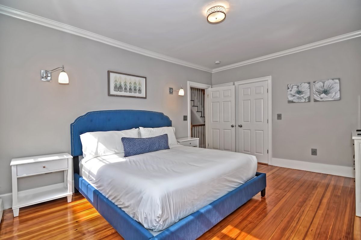 Spacious master bedroom with king bed and mountain views