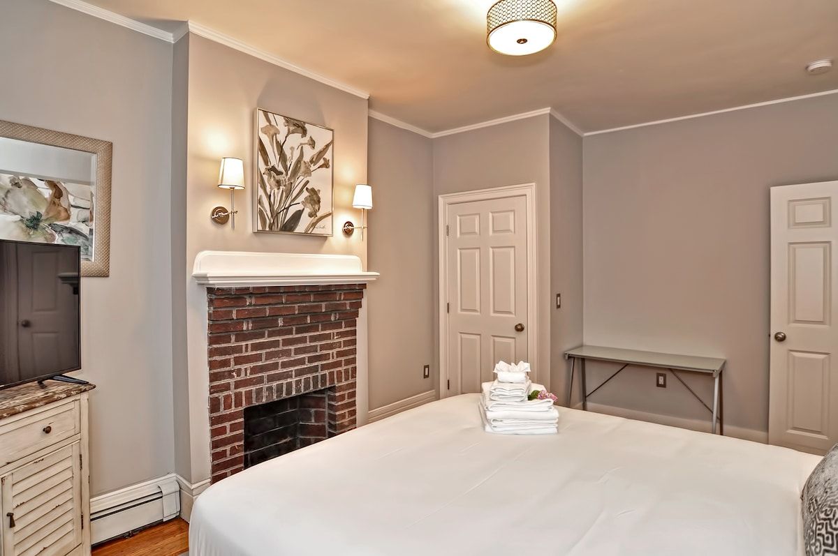 Spacious master bedroom with king bed and mountain views