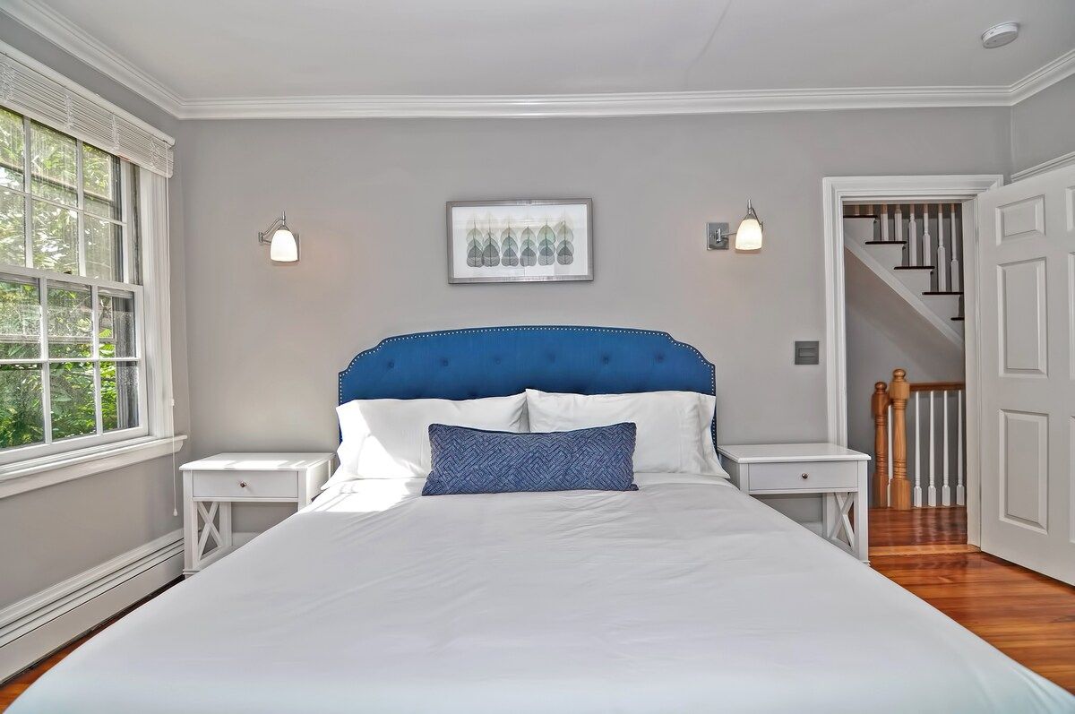 Spacious master bedroom with king bed and mountain views