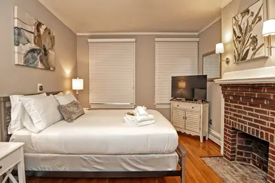 Spacious master bedroom with king bed and mountain views