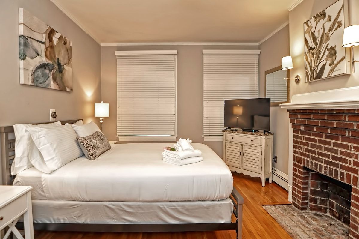 Spacious master bedroom with king bed and mountain views