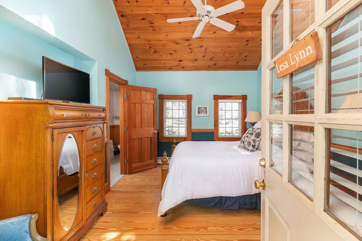 Spacious master bedroom with king bed and mountain views