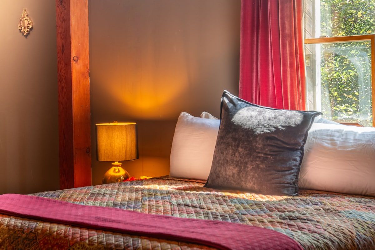 Spacious master bedroom with king bed and mountain views