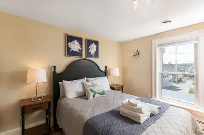 Spacious master bedroom with king bed and mountain views