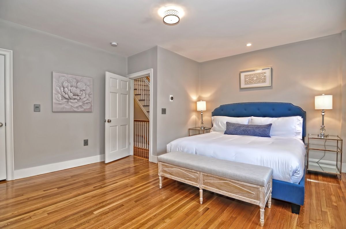 Spacious master bedroom with king bed and mountain views
