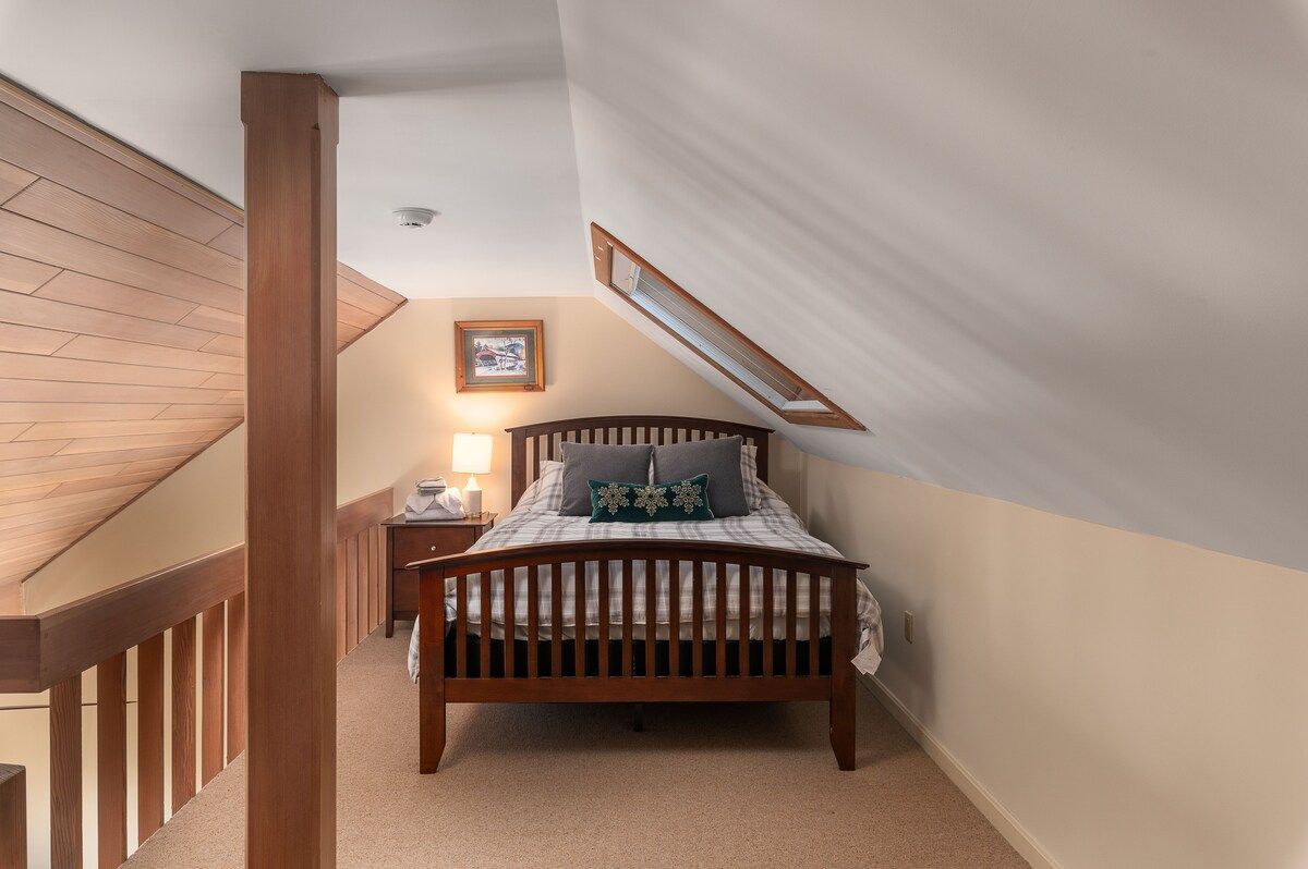 Cozy bedroom with a comfortable bed and warm lighting