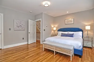 Spacious master bedroom with king bed and mountain views