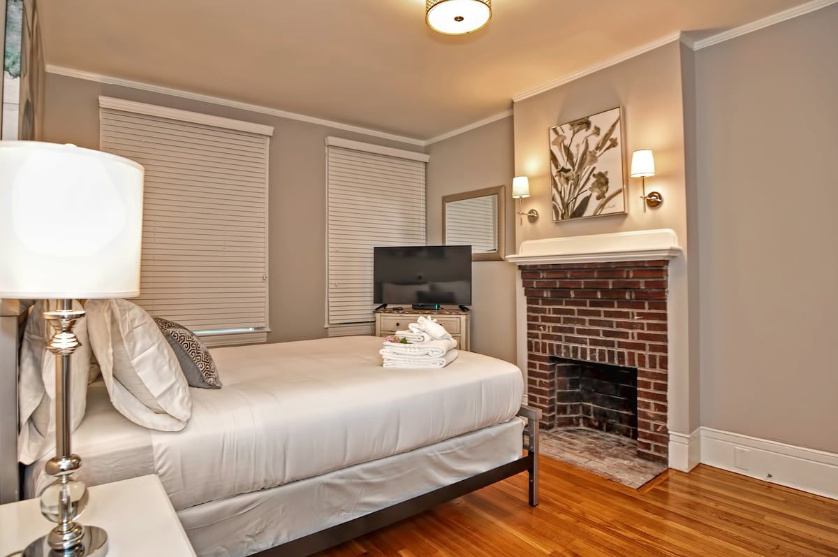 Spacious master bedroom with king bed and mountain views