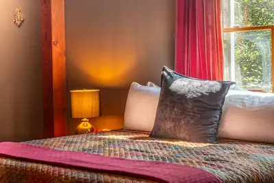 Spacious master bedroom with king bed and mountain views