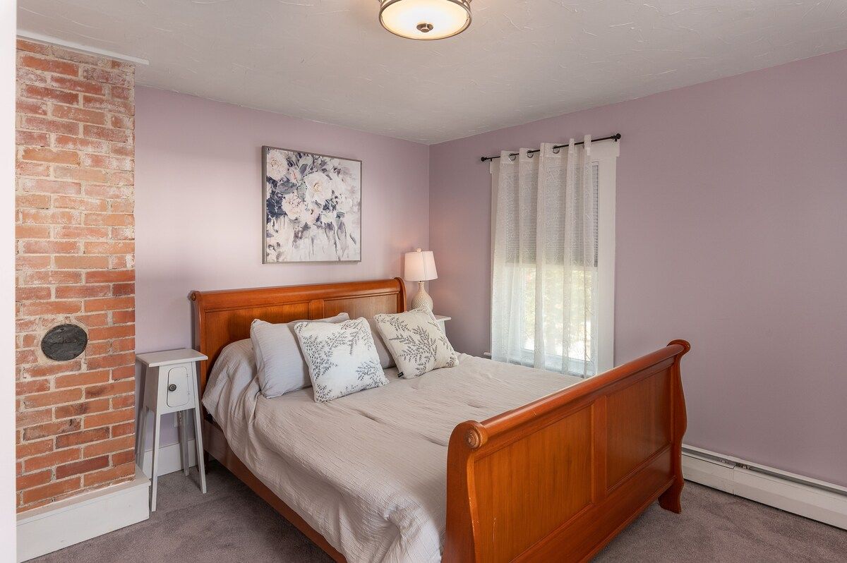Spacious master bedroom with king bed and mountain views