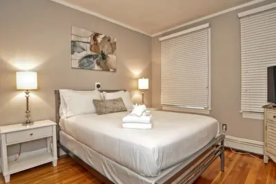 Spacious master bedroom with king bed and mountain views