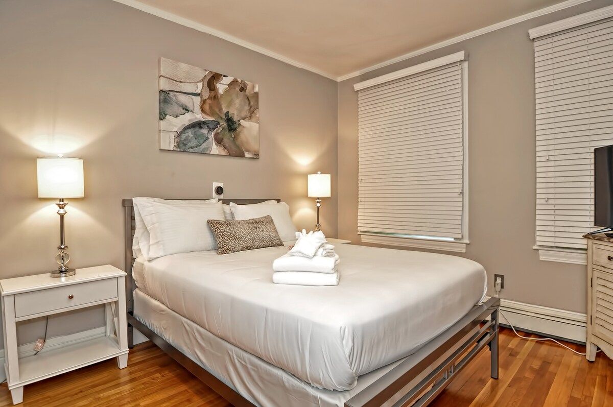 Spacious master bedroom with king bed and mountain views