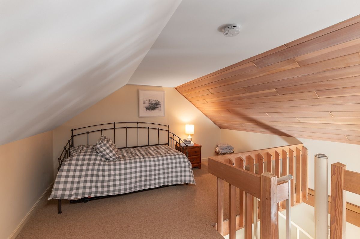 Cozy bedroom with a bed and a nightstand