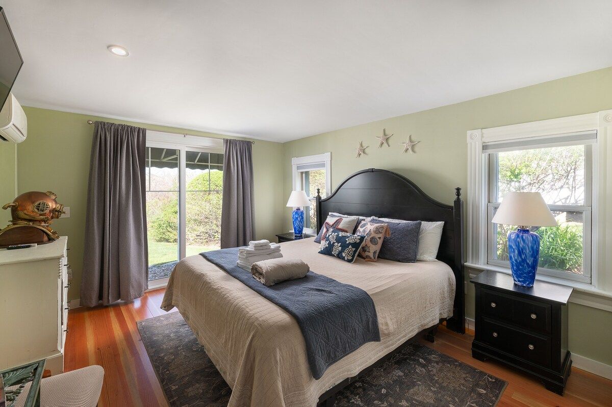 Spacious master bedroom with king bed and mountain views