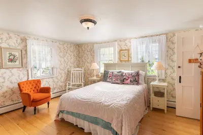 Spacious master bedroom with king bed and mountain views