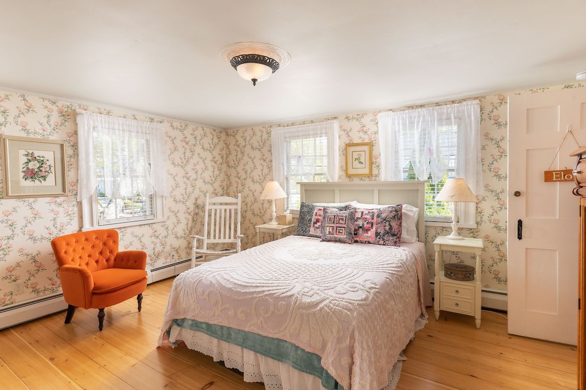 Spacious master bedroom with king bed and mountain views