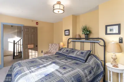 Spacious master bedroom with king bed and mountain views