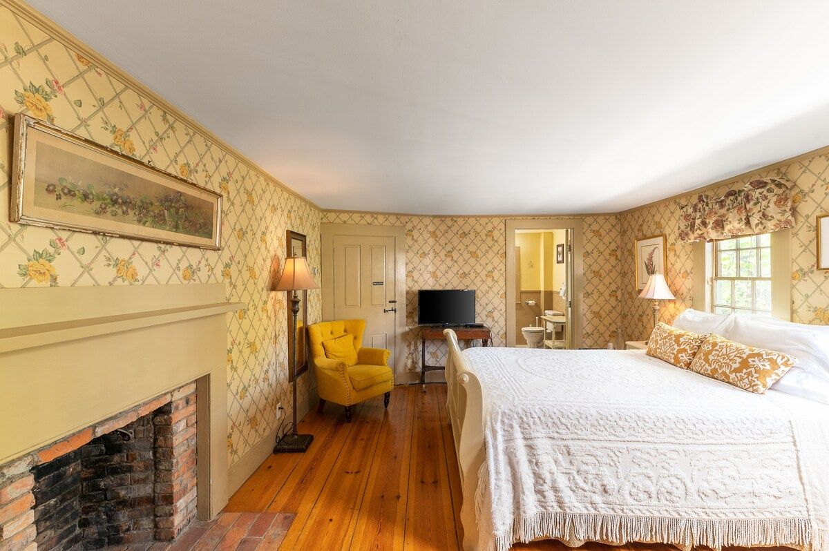 Spacious master bedroom with king bed and mountain views