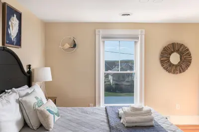 Spacious master bedroom with king bed and mountain views