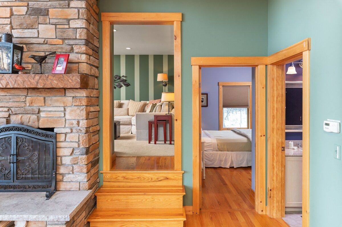 Spacious master bedroom with king bed and mountain views