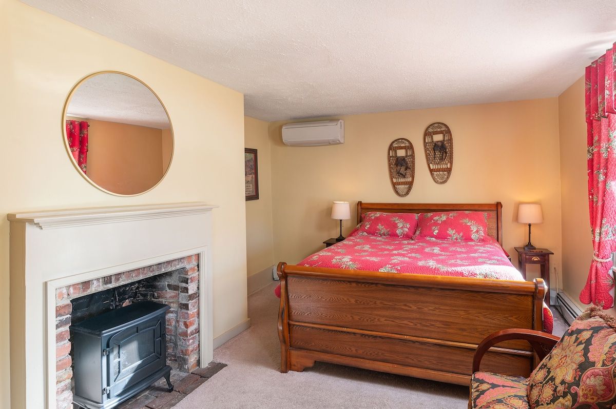 Spacious master bedroom with king bed and mountain views
