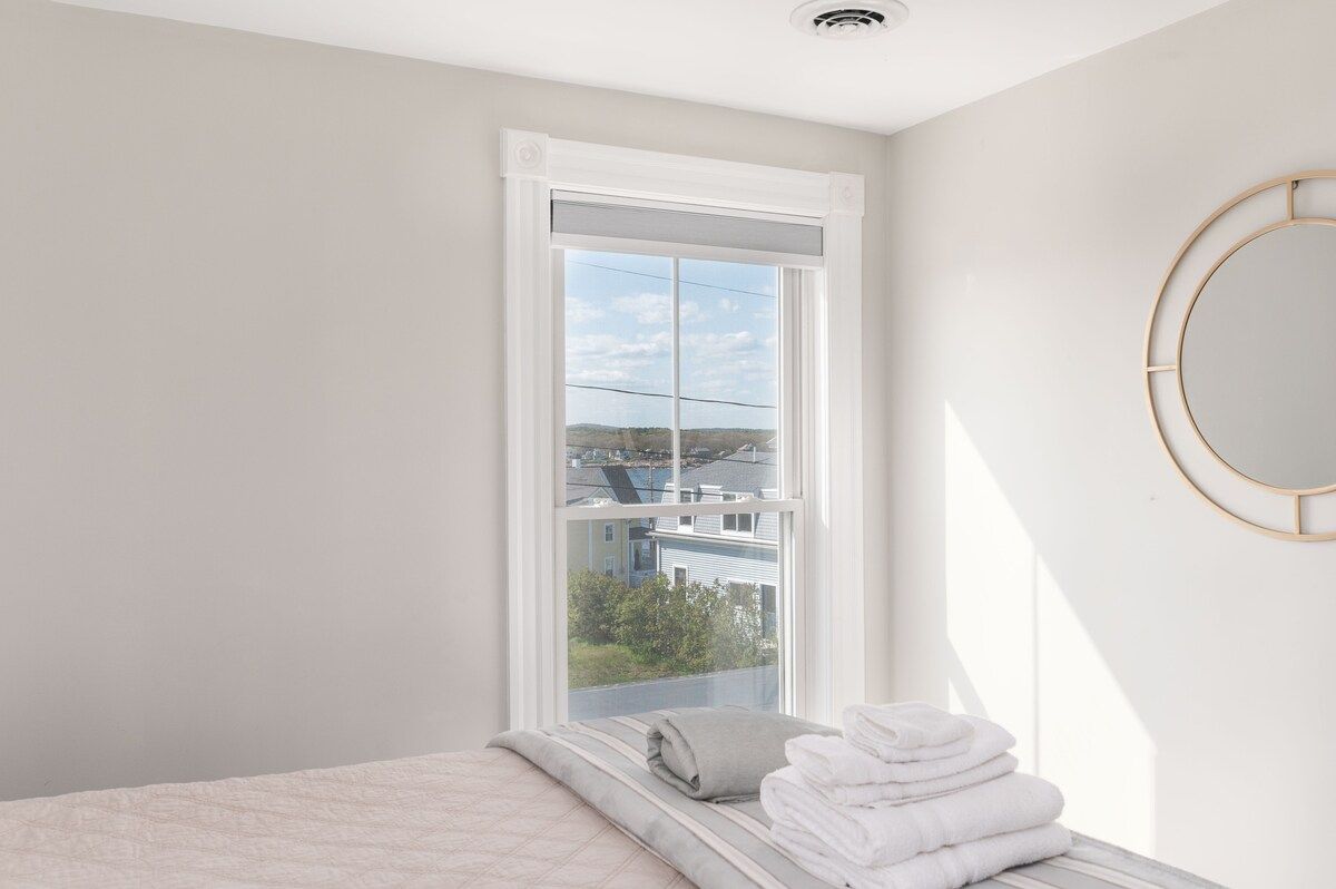 Spacious master bedroom with king bed and mountain views