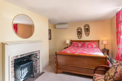 Spacious master bedroom with king bed and mountain views