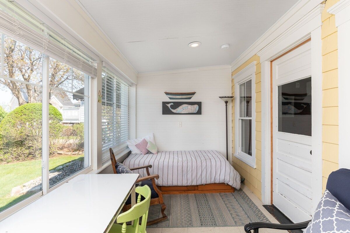 Cozy bedroom with a bed and a view of the garden