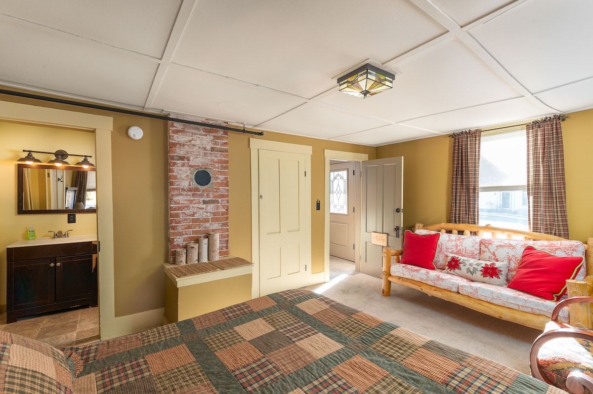 Spacious master bedroom with king bed and mountain views