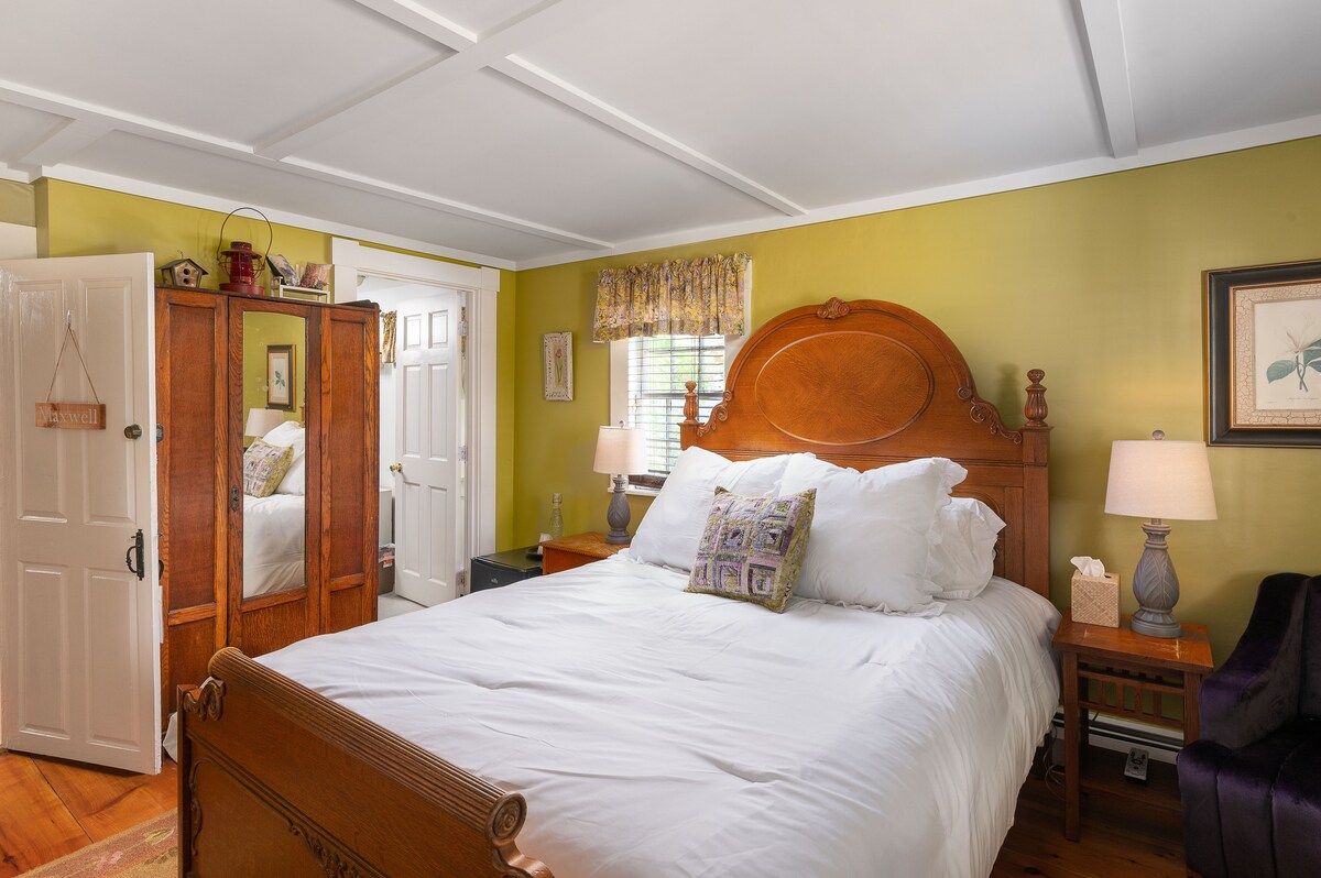 Spacious master bedroom with king bed and mountain views