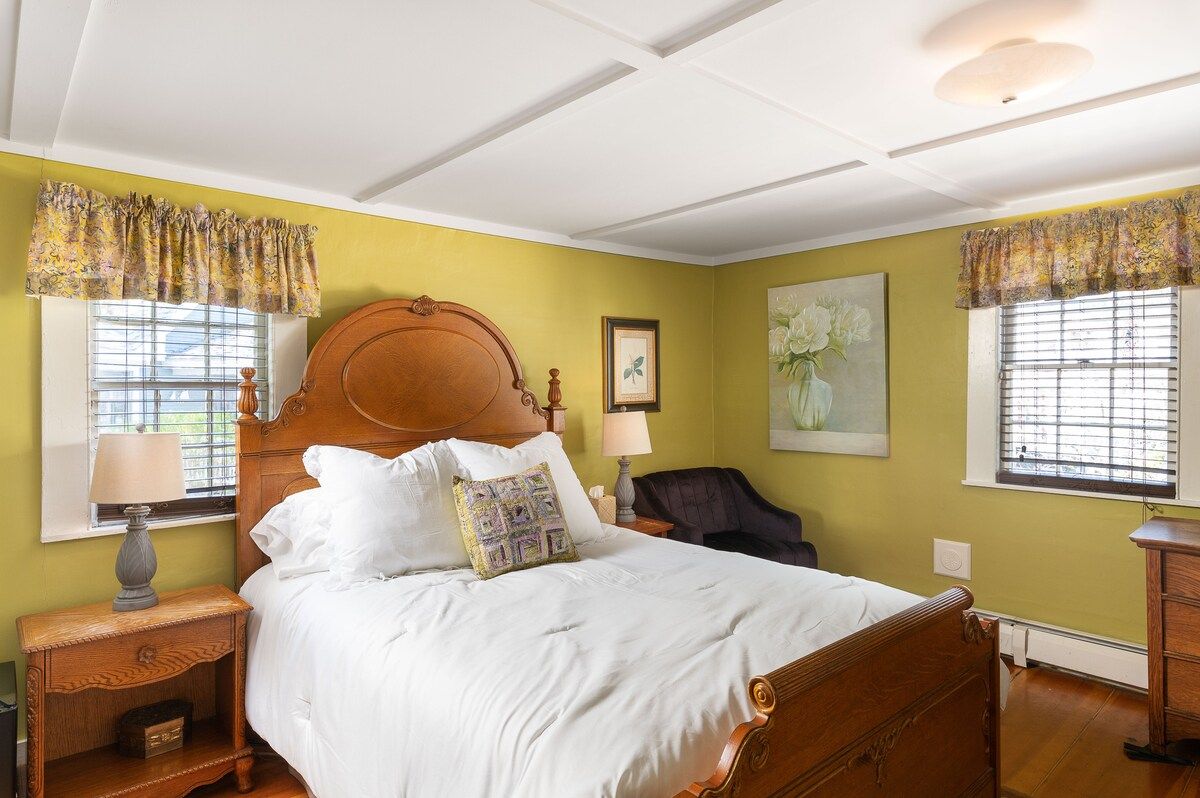 Spacious master bedroom with king bed and mountain views