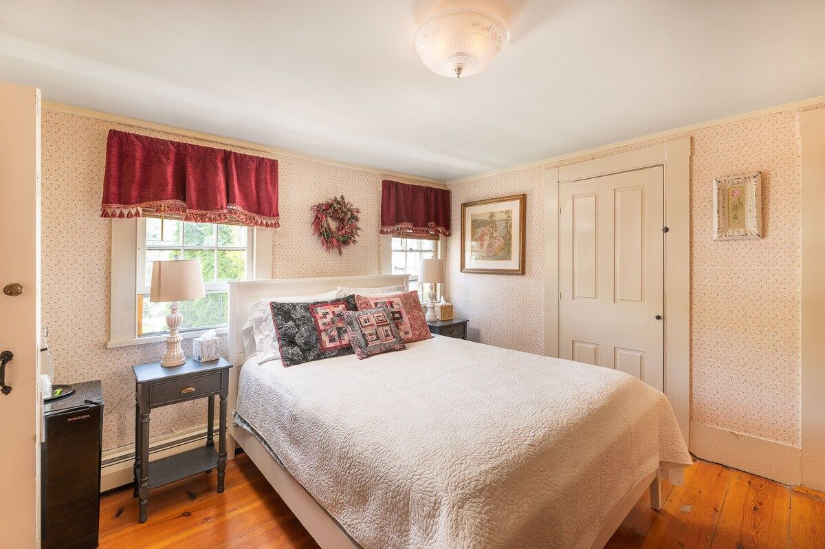 Spacious master bedroom with king bed and mountain views