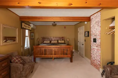 Spacious master bedroom with king bed and mountain views