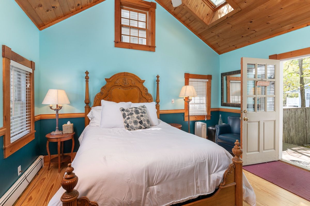 Spacious master bedroom with king bed and mountain views