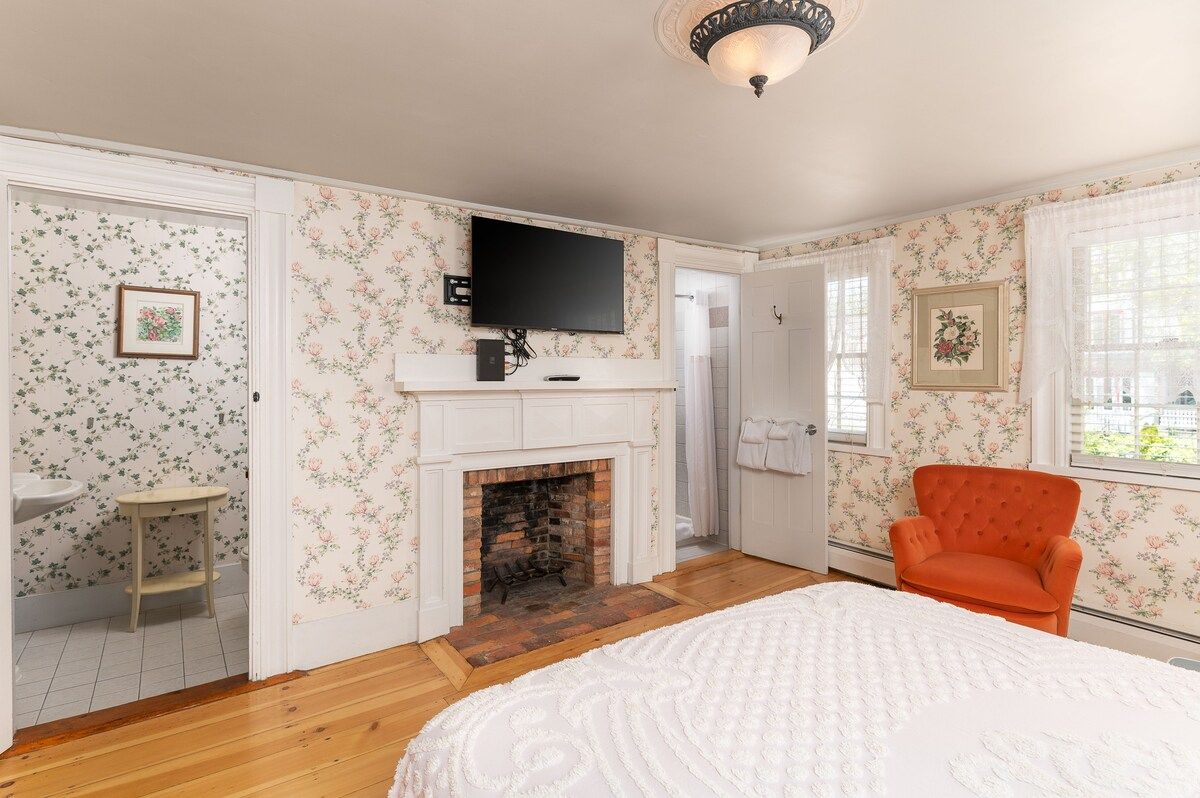 Spacious master bedroom with king bed and mountain views