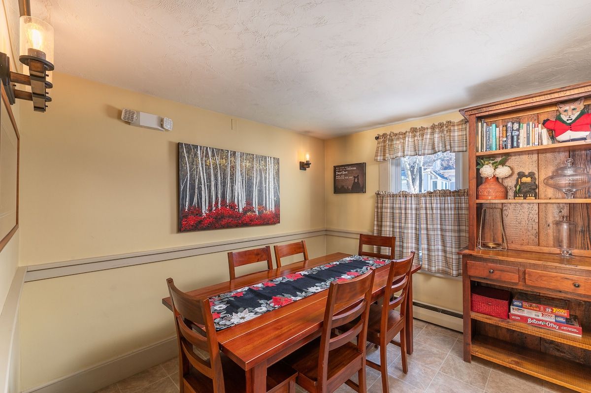 Cozy dining area with a wooden table and chairs, perfect for family meals.
