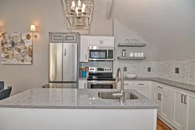Modern kitchen with stainless steel appliances and a large island