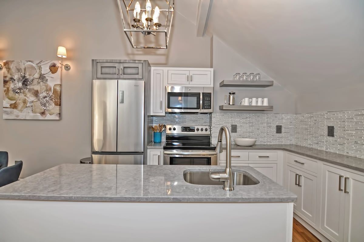 Modern kitchen with stainless steel appliances and a large island