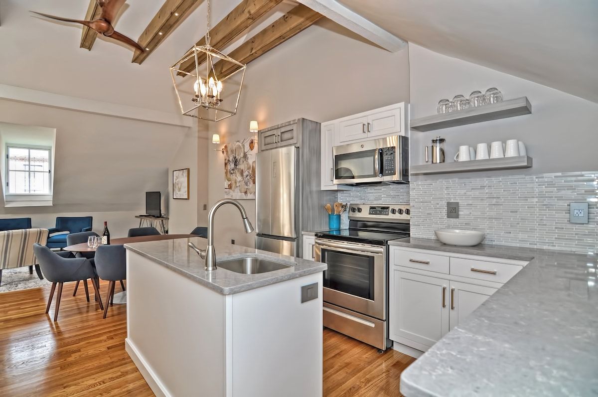 Modern kitchen with stainless steel appliances and white cabinets