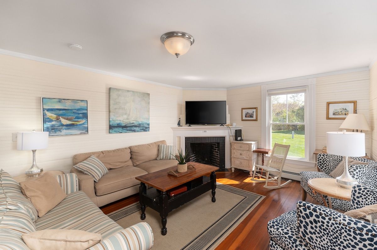 Cozy living room with a fireplace, TV, and comfortable seating area