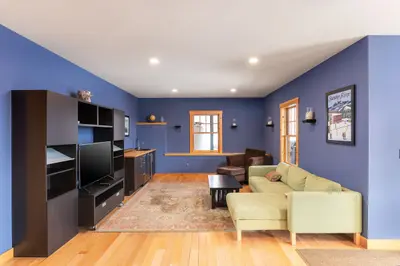 Cozy living room with a sectional sofa and large TV on the entertainment center