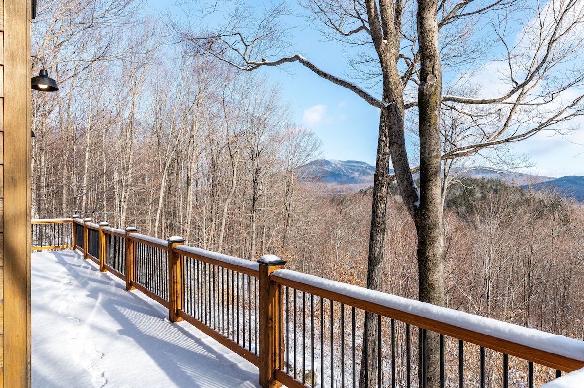 Snowy deck with a view of the mountains
