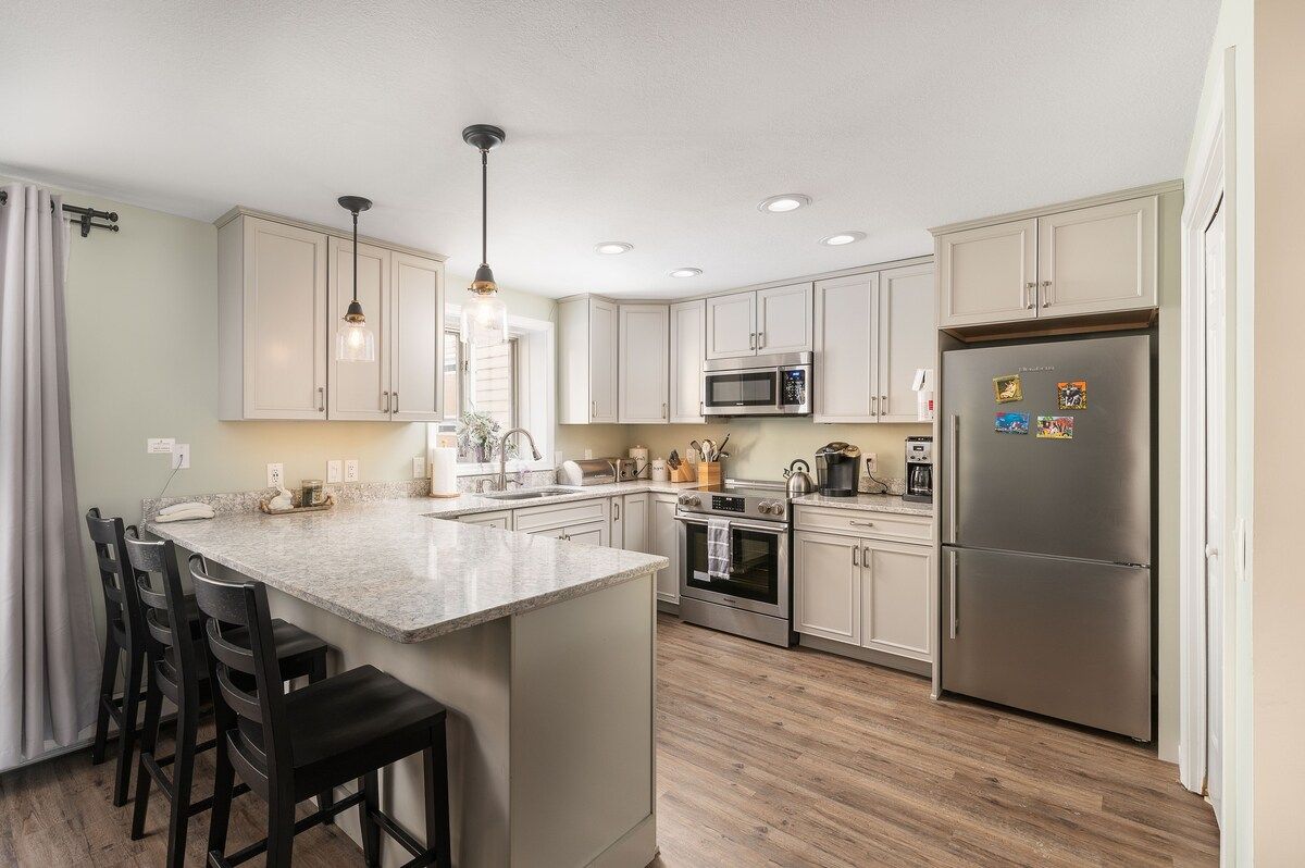 Modern kitchen with stainless steel appliances and a large island
