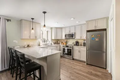 Modern kitchen with stainless steel appliances and a large island